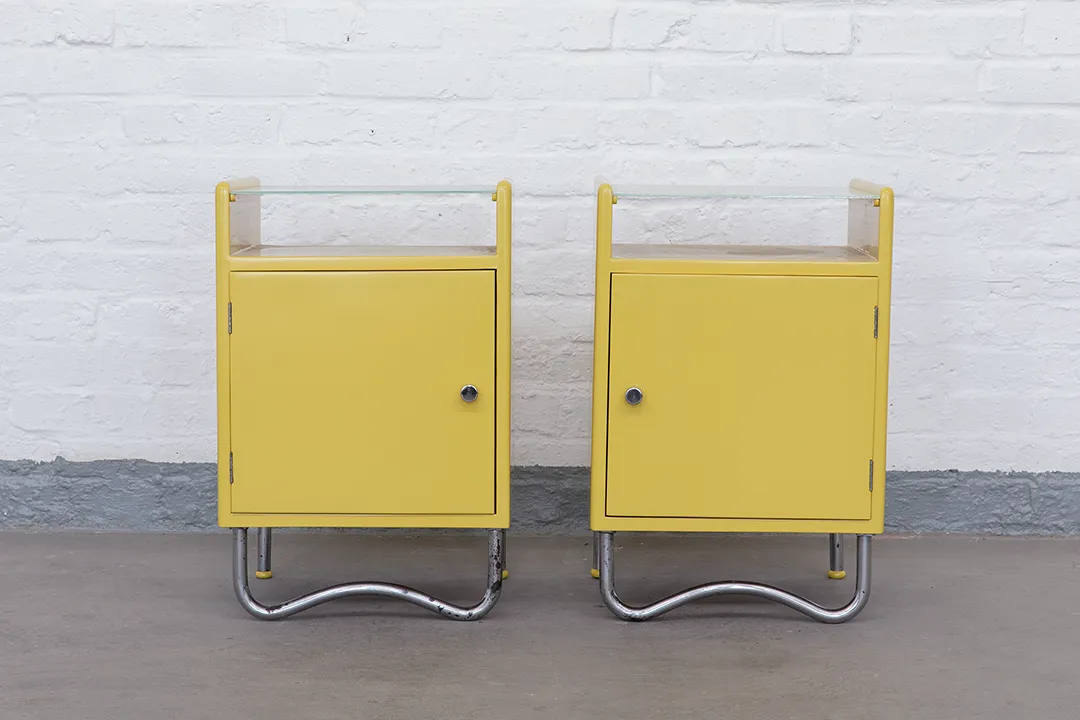 Restored Bauhaus bedside table by Hynek Gottwald – yellow lacquered finish with Opal glass top and tubular steel base.