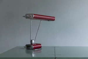 Jumo 71 “Eileen Gray” desk lamp, France, late 1940s. Chrome-plated metal, red lacquered shade, B22 fittings, LED equipped.