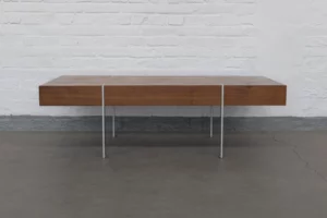 1960s International Style sofa table with walnut veneer top and flat-steel base, combining warm wood tones with minimalist modern design.