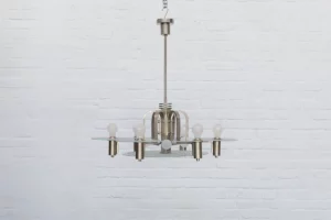 Rare 1930s ceiling light from Germany, part of the expressive Machine Age movement. Nickel-plated brass structure with six glass shades featuring concave engraved detailing. Restored condition.