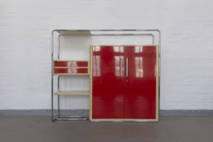 Front view of the original B290 cabinet designed by Bruno Weill for Thonet-Paris, ca. 1930, featuring a tubular steel frame, two-tone lacquered wooden corpus, drawers, shelving elements and large Bauhaus-style cylindrical handles.