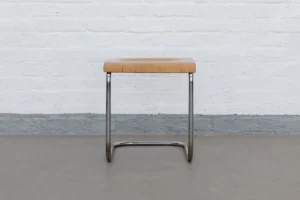 Original Bauhaus tubular steel stool from the 1930s with chromed tubular steel frame and honey-toned beechwood seat, model B43, functionalist design.