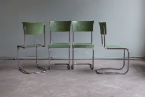 Set of original Bauhaus cantilever chairs model B43, designed by Mart Stam and produced by Thonet-Mundus in an early production series around 1930. Tubular steel frames with original chrome plating, seats and backrests in original Thonet factory finish in green with age-related wear and partial paint loss. All screws original. Authentic surfaces with a coherent, museum-quality appearance.