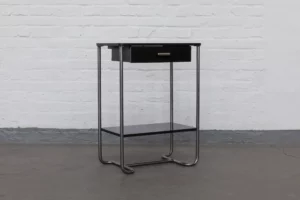 Bauhaus console by Mücke-Melder from the 1930s featuring a chromed tubular steel frame, black-lacquered joinery panels, drawer and lower shelf.