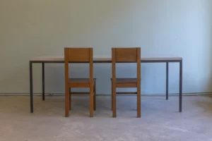 KADEMO International Style table with square steel frame and concrete tabletop. Handcrafted KADEMO Edition, available in custom configurations.