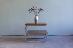 1930s tubular steel side table with two tiers and veneered tops in the style of Bauhaus modernism.