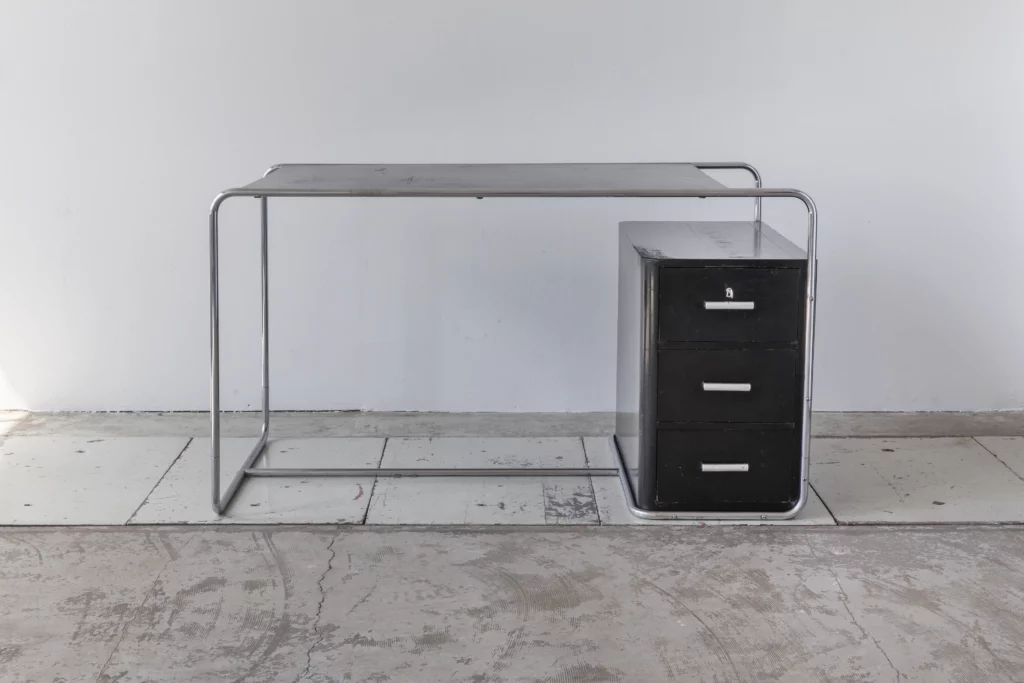Original Bruno Weil B282 desk designed for Thonet-Frères Paris in the early 1930s. Bauhaus tubular steel desk with chromed tubular steel, black lacquered wooden panels, a three-drawer pedestal and original roller handles in museum-quality original condition.