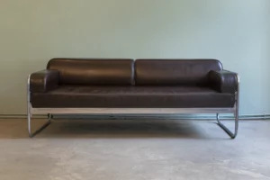 1930s tubular steel sofa with chestnut brown leather upholstery and chrome-plated tubular steel frame. Professionally restored around ten years ago and offered in very good used condition.