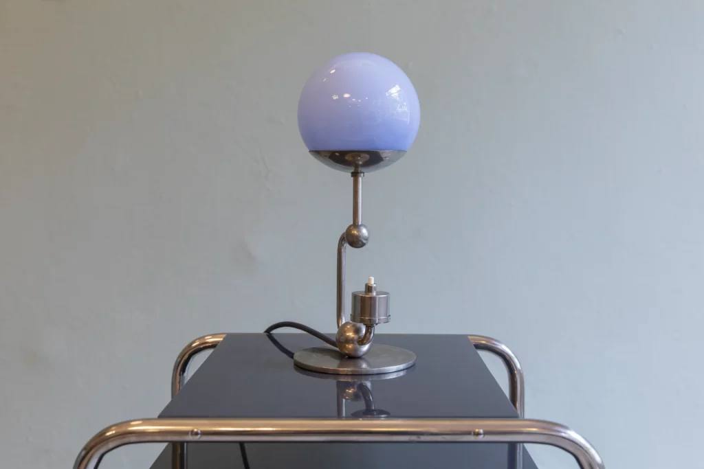 Bauhaus table lamp from the 1930s in nickel-plated brass with an original light blue opaline glass shade.